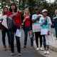 Protesters and activists stand at attention as the national anthem is sung to open a Loudoun County Public Schools (LCPS) board meeting in Ashburn, Virginia, on October 12, 2021